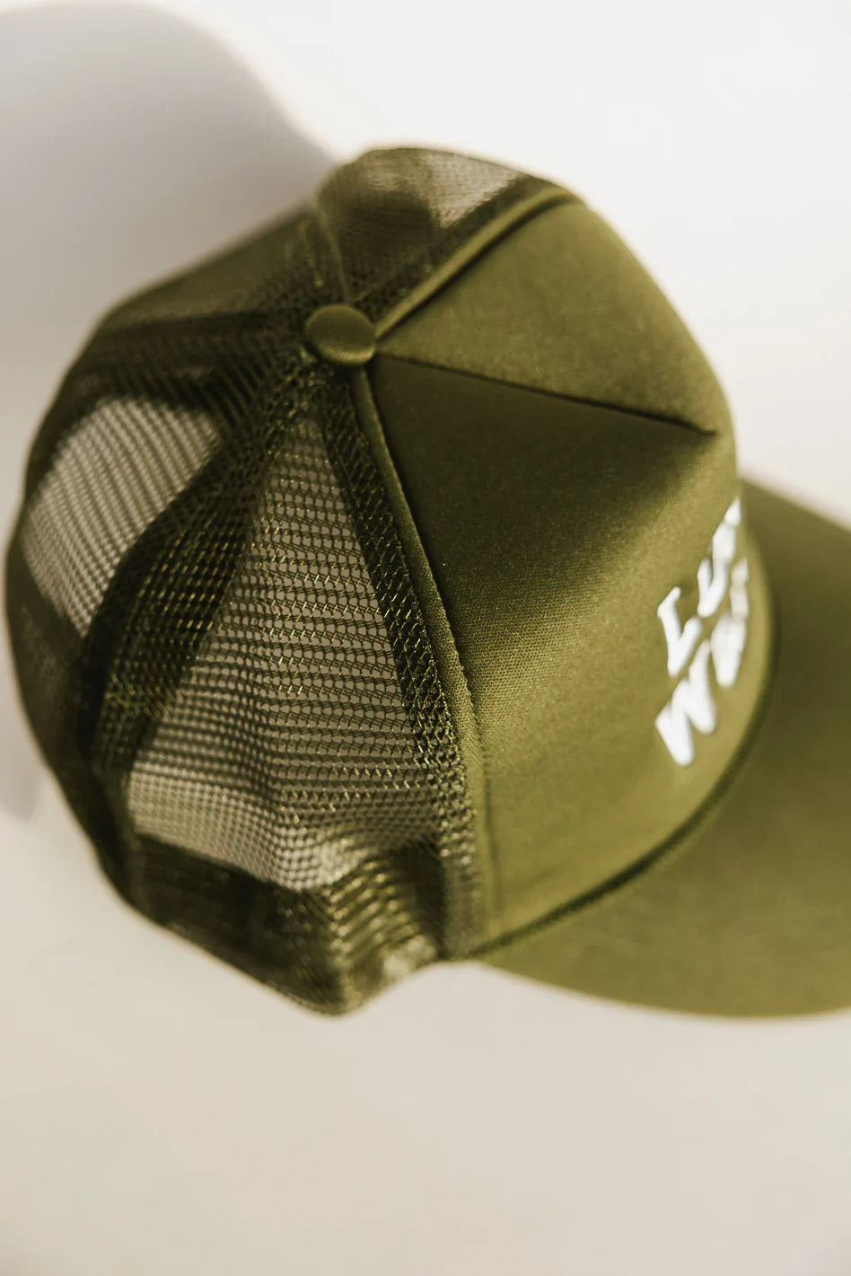 Long Weekend Trucker Hat in Olive